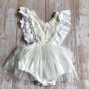 Adorable ruffled romper.